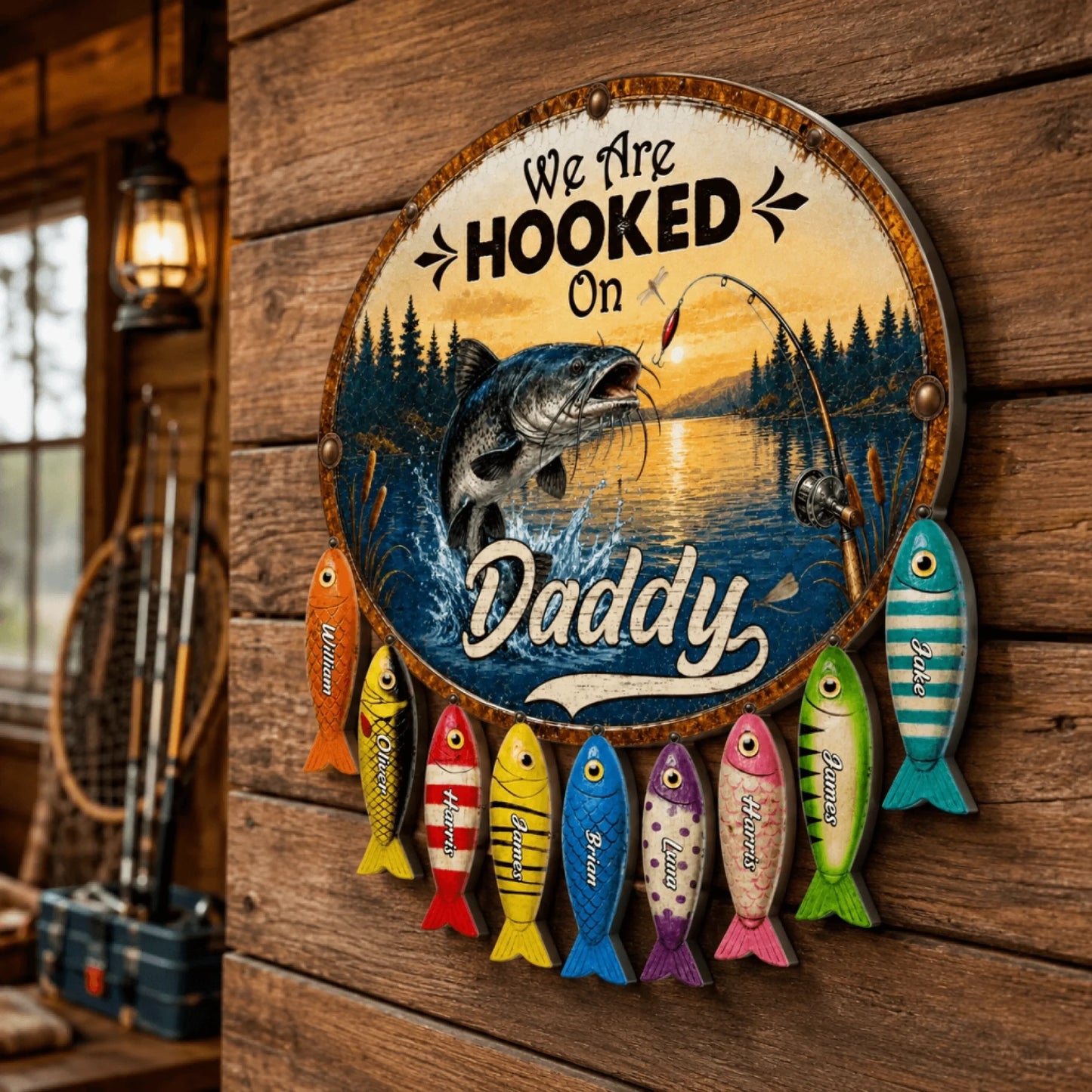 Decorative sign with fishing theme and text 'We Are Hooked On Daddy' on a wooden wall.