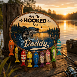 Decorative sign with fishing theme and colorful fish below, set against a sunset lake backdrop.
