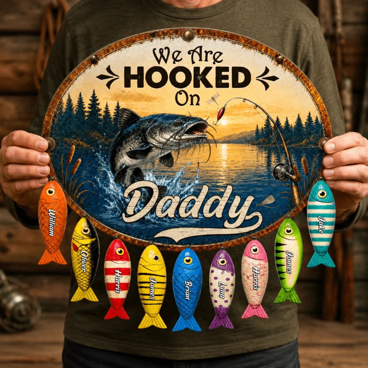 Person holding a decorative sign with fishing-themed design and colorful fish below.