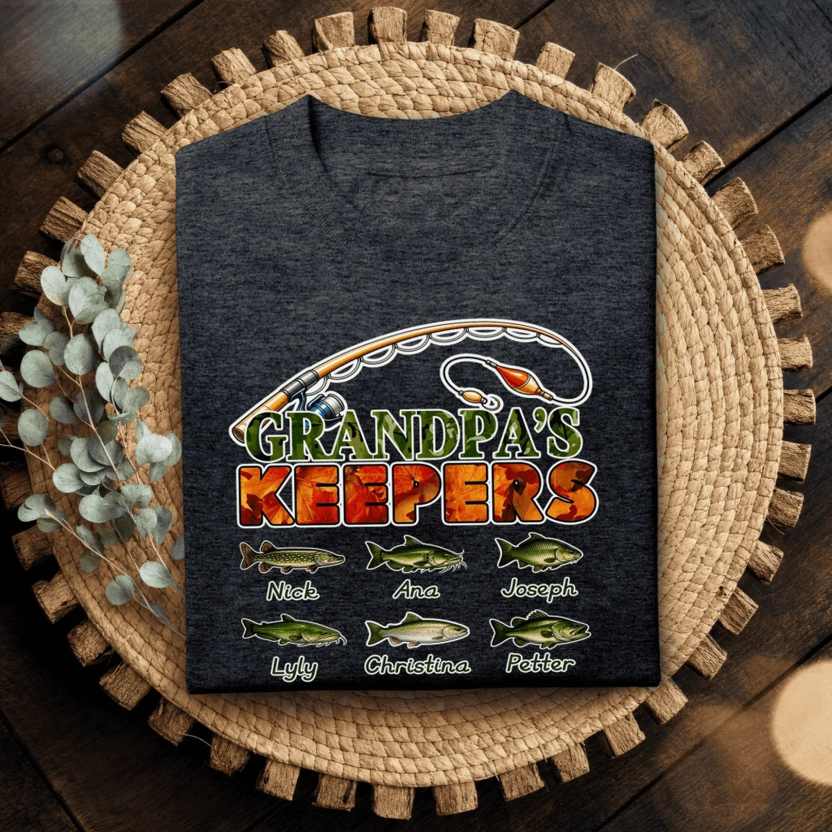 Dark grey custom fishing t-shirt for men with the design Grandpas Keepers and six personalized names below fish icons.