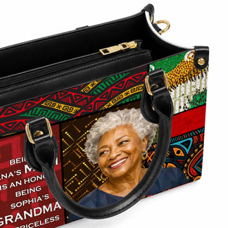 Close-up detail of a custom grandma tote bag showcasing the vibrant African-inspired art, high-quality leather handles, and the sentimental quote about family roles.
