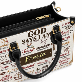 Close up of a premium PU leather handbag with gold zipper details and inspirational religious text printed on it.
