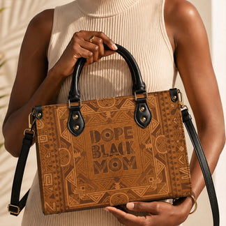 A stylish brown PU leather handbag featuring a bold Dope Black Mom graphic design with intricate tribal patterns.