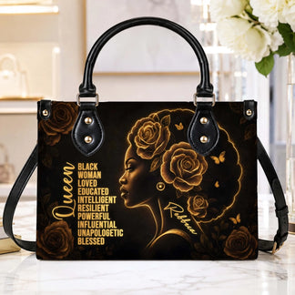 Elegant black queen tote bag with gold floral accents and a personalized name, perfect for a thoughtful custom gift.