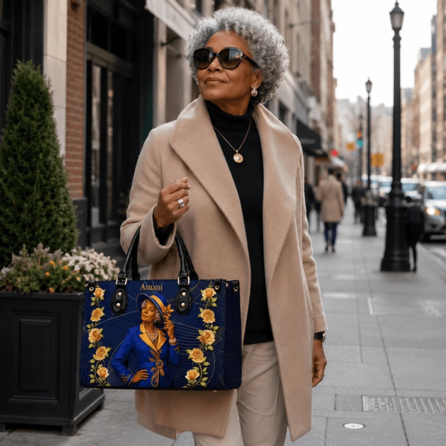 Stylish woman wearing a beige coat holding a personalized handbag with a custom portrait and Amani name text.