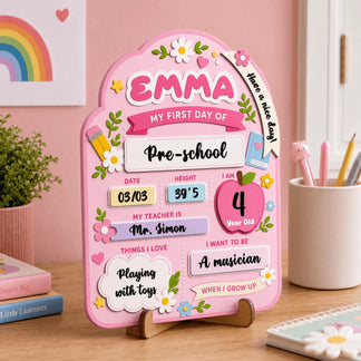 Personalized wooden first day of preschool sign with name Emma, date, height, teacher name, and future career goals.