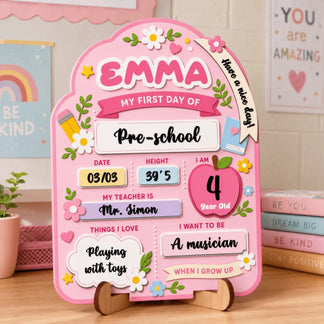 Personalized wooden first day of preschool sign with name Emma, date, height, teacher name, and future career goals.