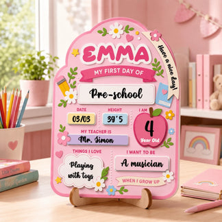 Personalized wooden first day of preschool sign with name Emma, date, height, teacher name, and future career goals.