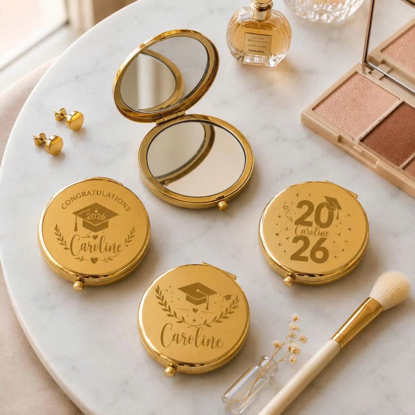 Collection of elegant gold compact mirrors personalized for graduation with custom names and year of 2026.