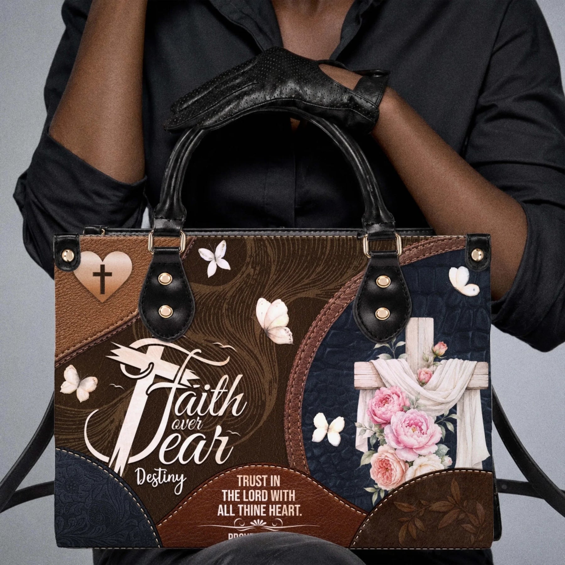 Brown and blue christian tote bag featuring a cross floral design butterflies and the faith over fear proverbs 3 5 quote.