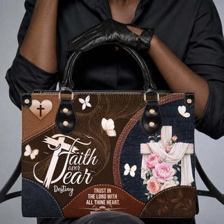 Brown and blue christian tote bag featuring a cross floral design butterflies and the faith over fear proverbs 3 5 quote.