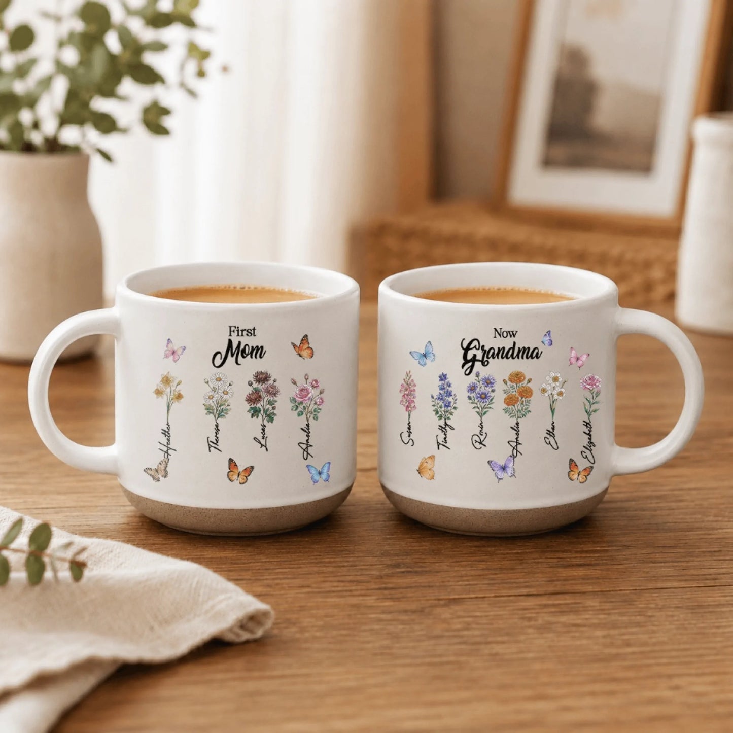 A set of two custom mugs showing birth flower bouquets for mothers and grandmothers with butterfly decorations.