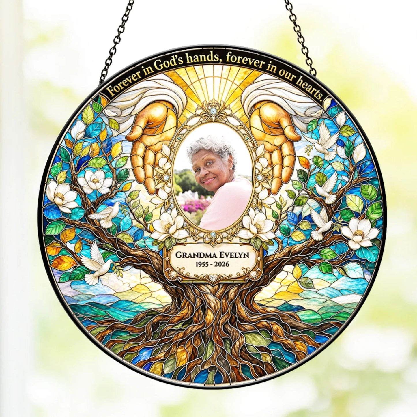 Personalized memorial stained glass suncatcher featuring Grandma Evelyn with angel hands and a tree of life design.