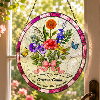 Grandma’s Garden glass suncatcher on window with pink floral border, butterflies, and custom grandkids names