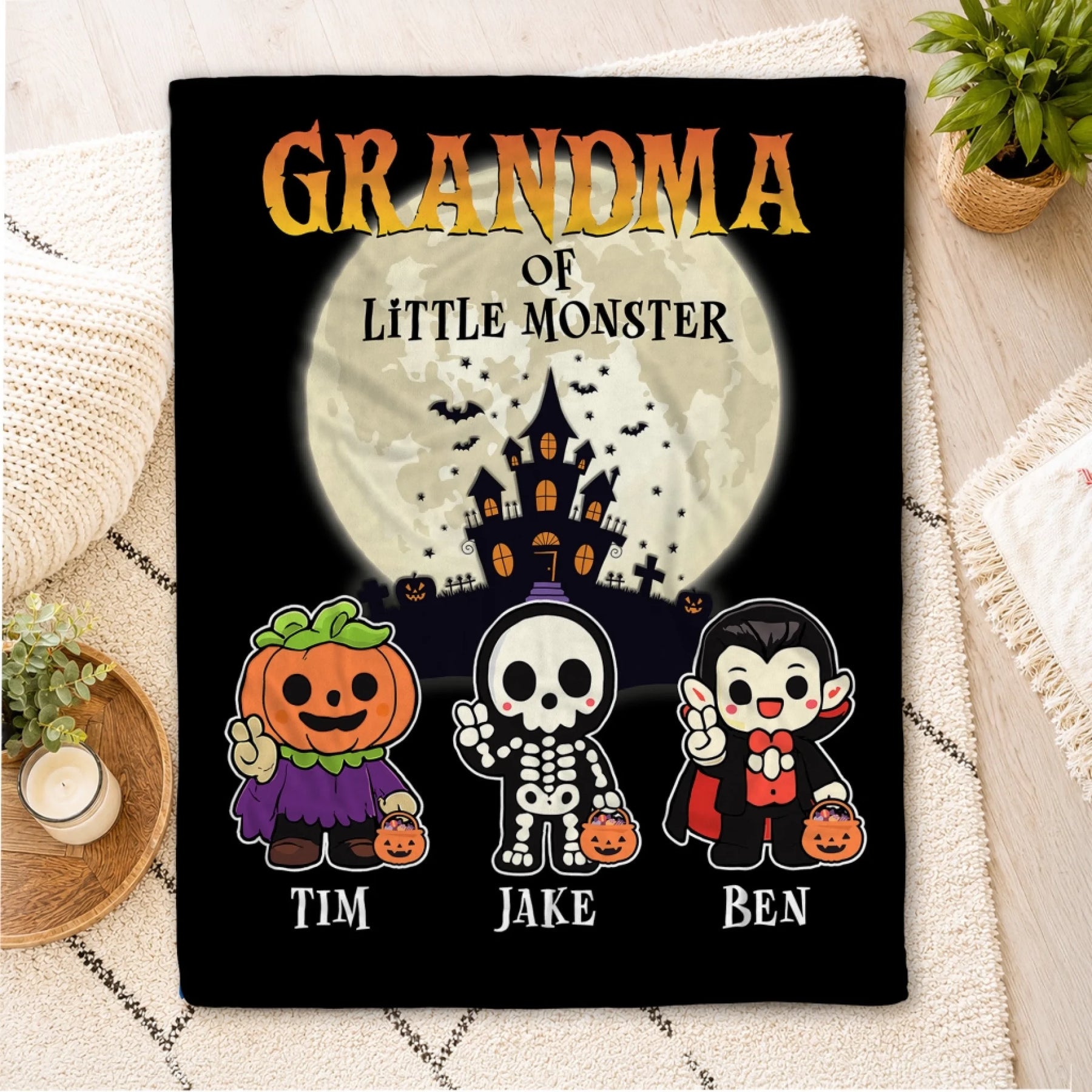 Personalized Halloween fleece blanket featuring a haunted house design and custom names for a grandma gift.