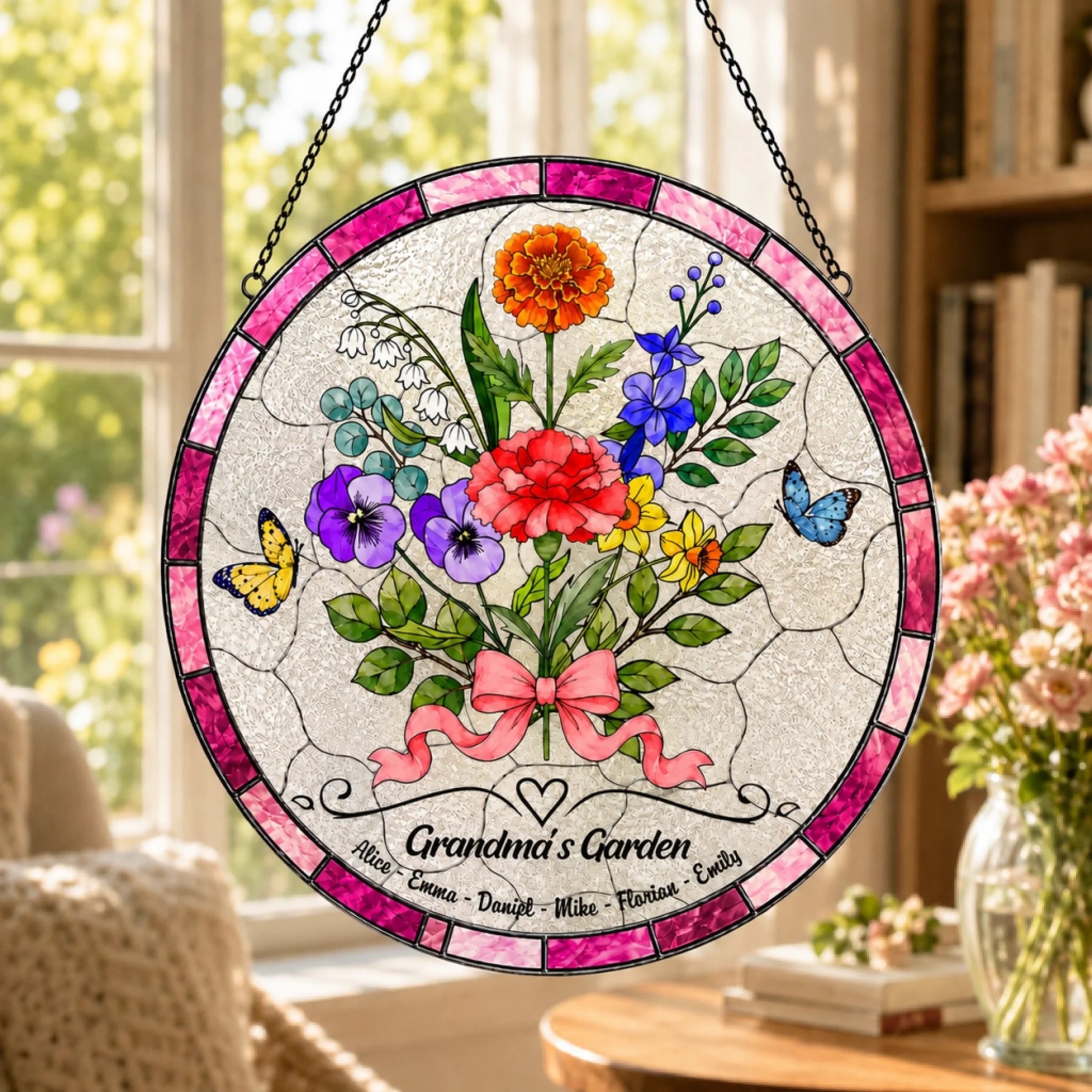 Grandma’s Garden floral glass suncatcher hanging by black chain in cozy sunlit living room window