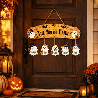 Decorative personalized Halloween wooden door hanger featuring a ghost family, hanging ornaments, and cute pumpkin accents.