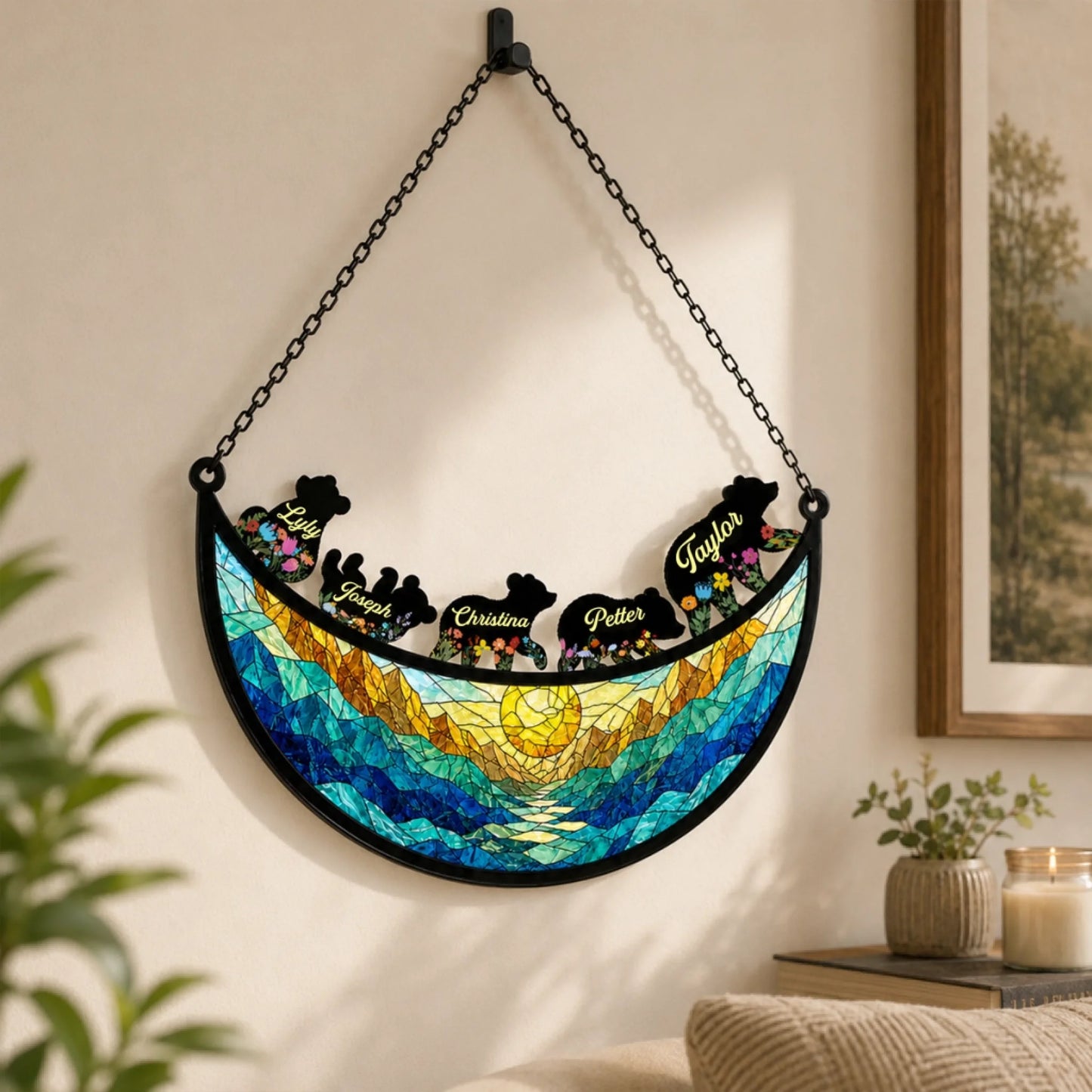 Personalized family bear acrylic suncatcher hanging on a wall, featuring custom names and a scenic mountain sunset.