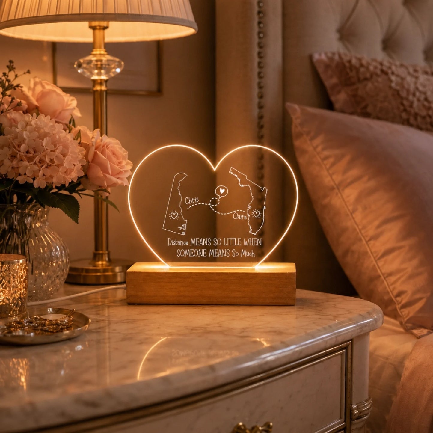 heart shaped custom map acrylic lamp next to a picture frame