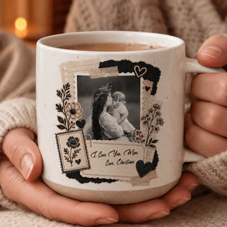 Close-up of hands holding a custom-designed ceramic mug featuring a sentimental mother and baby photo collage.