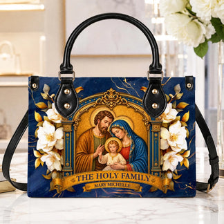 A beautiful blue tote bag featuring The Holy Family artwork and the personalized name Mary Michelle, perfect for religious gifts.