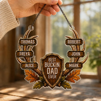 Close-up of personalized hunting suncatcher hanging on window