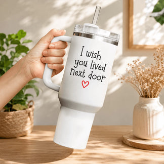 White personalized tumbler featuring the heartfelt quote I wish you lived next door with a red heart icon.