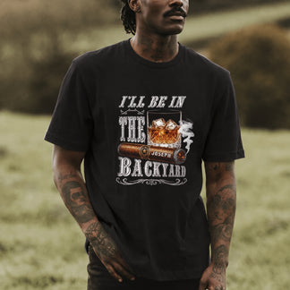 Custom men's t-shirt featuring a cigar and whiskey graphic with the personalized name Joseph, casual backyard style.