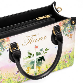 Interior view of a personalized floral cross tote bag showing the zipper compartment and custom garden art print.