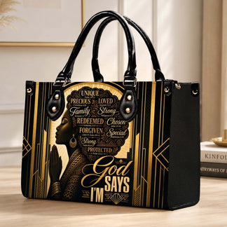 Stylish faith-inspired handbag with a gold and black art deco pattern and a praying woman portrait illustration.