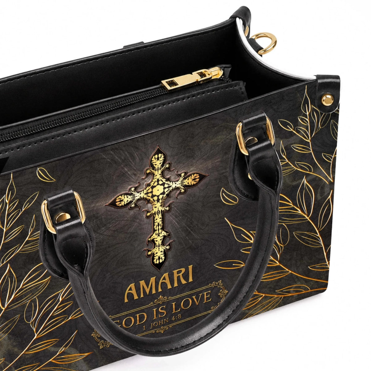 Close up inside a black personalized tote bag with gold cross design and zipper pocket for organized daily carry
