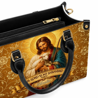 Interior detail of a custom religious themed purse showing the secure zipper compartment and quality PU leather lining.