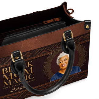 Interior view of a customized leather handbag with spacious compartments and a Black Mom Magic personalized design