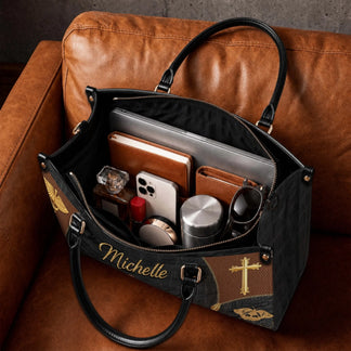 Spacious interior of a personalized nurse tote bag showing a laptop notebook and personal items on a leather sofa.