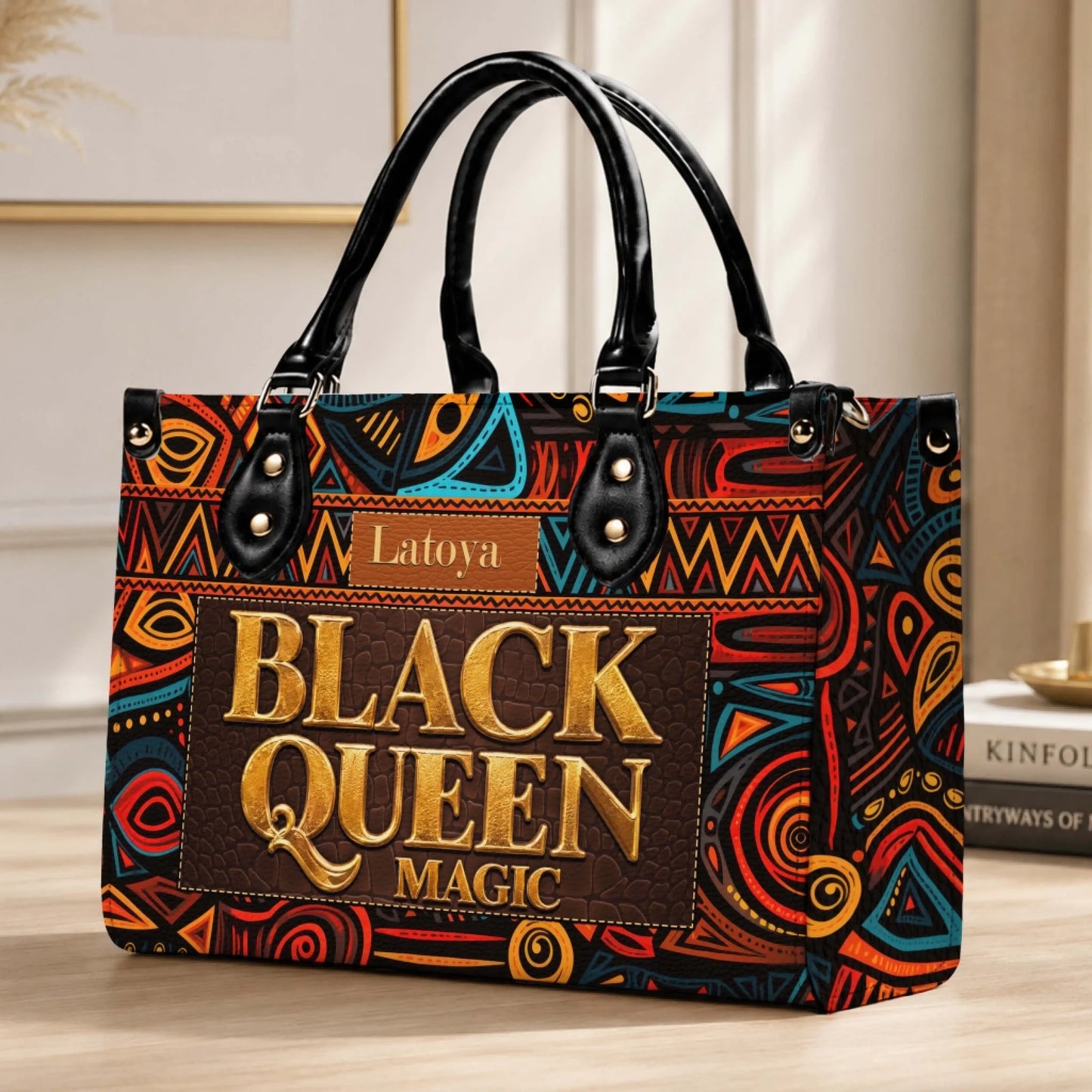 Personalized Black Queen Magic tote bag featuring an ethnic geometric pattern and customizable name tag for women.