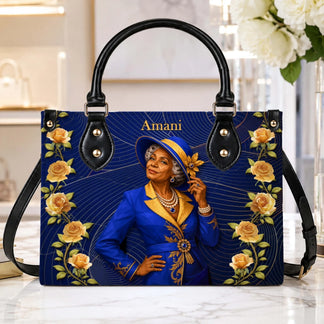 High-quality handbag showcasing a custom portrait of a woman in a blue suit surrounded by yellow roses.