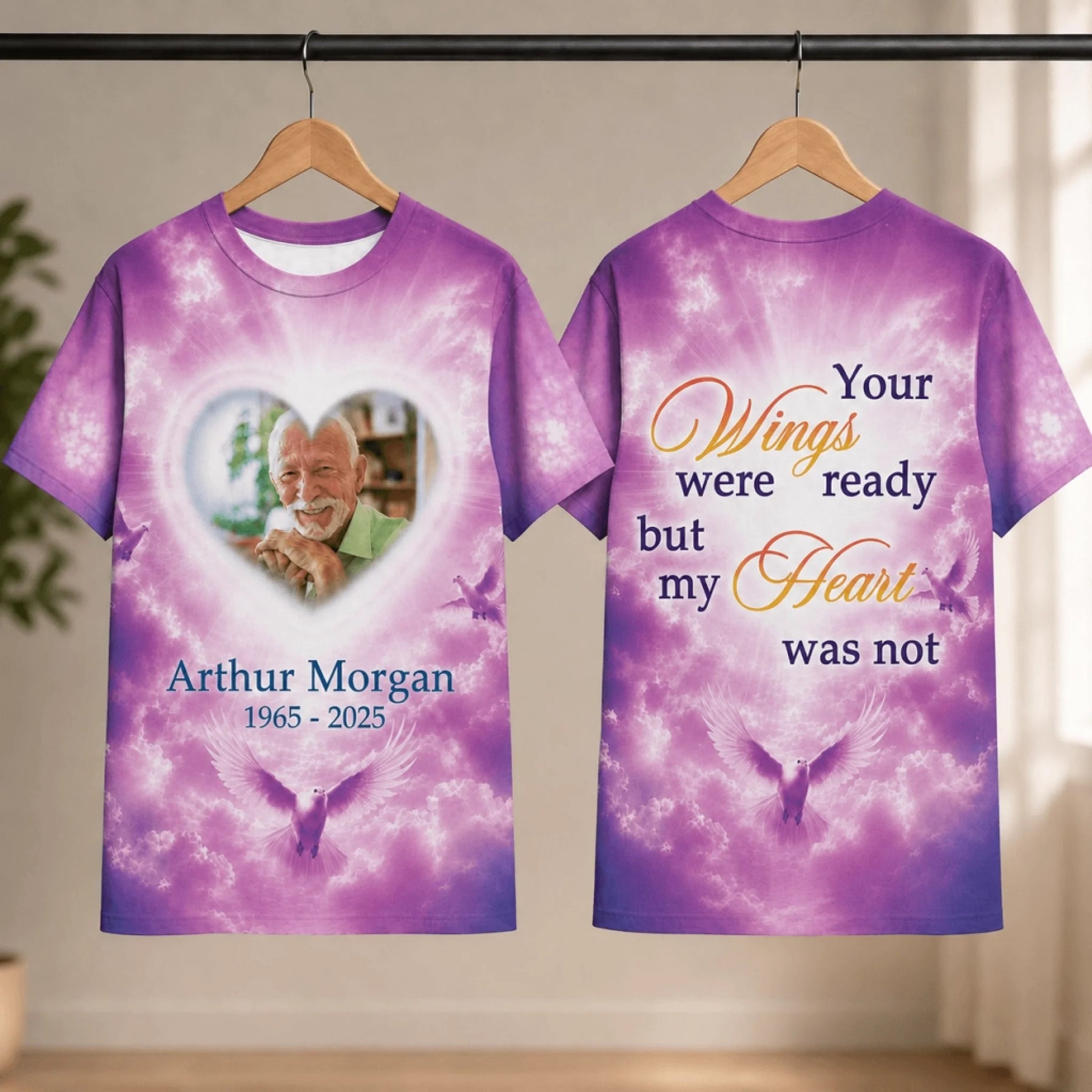 Custom memorial t-shirt with a heart photo frame, name, dates, and doves on a beautiful purple sky background.
