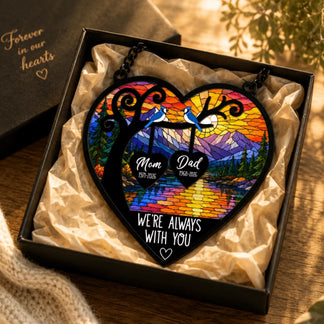 Heart shaped memorial acrylic suncatcher featuring a stained glass mountain scene with blue jays and personalized names and years.