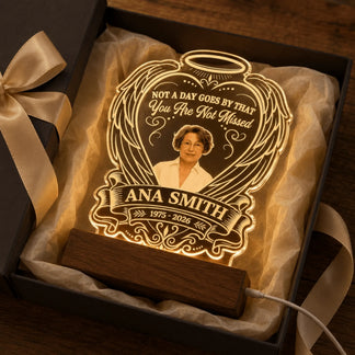 Personalized memorial LED acrylic night light packaged inside a premium gift box with golden ribbon.