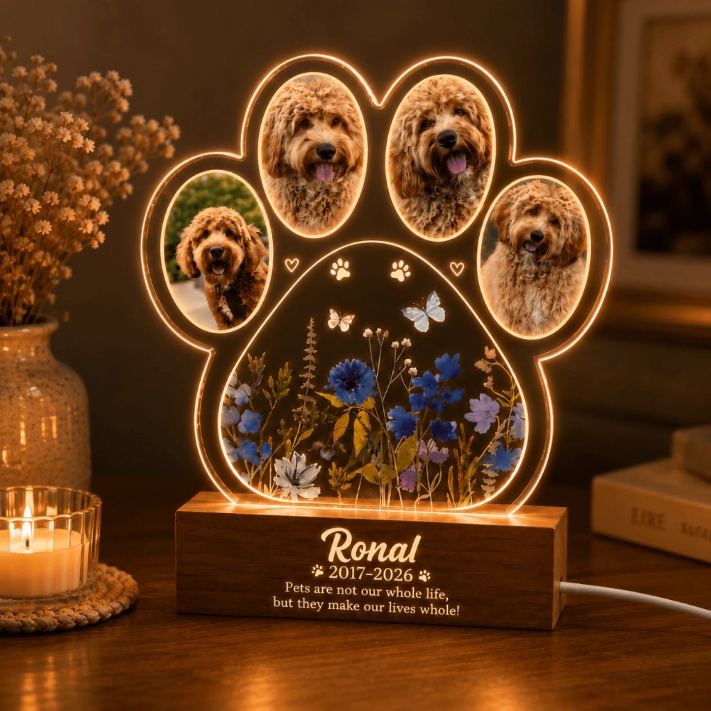 Custom pet memorial LED night light showcasing four photos inside a paw print design with floral accents and text.