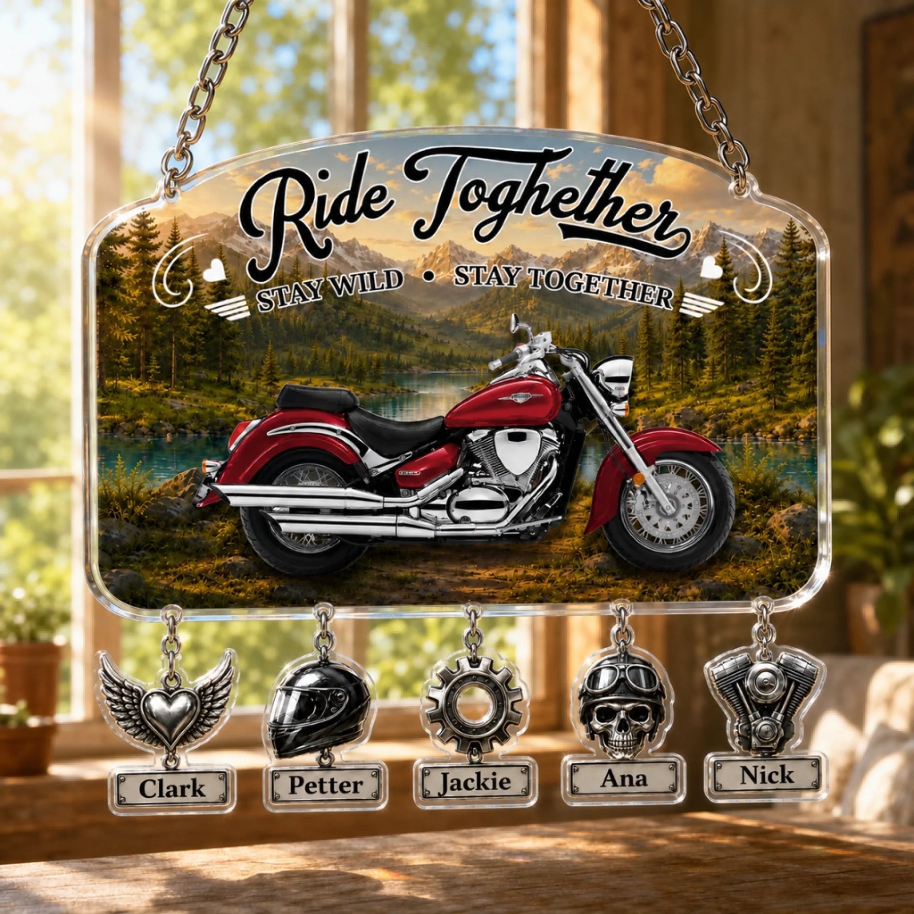 Close-up of personalized motorcycle dad suncatcher with engraved kids names on charms