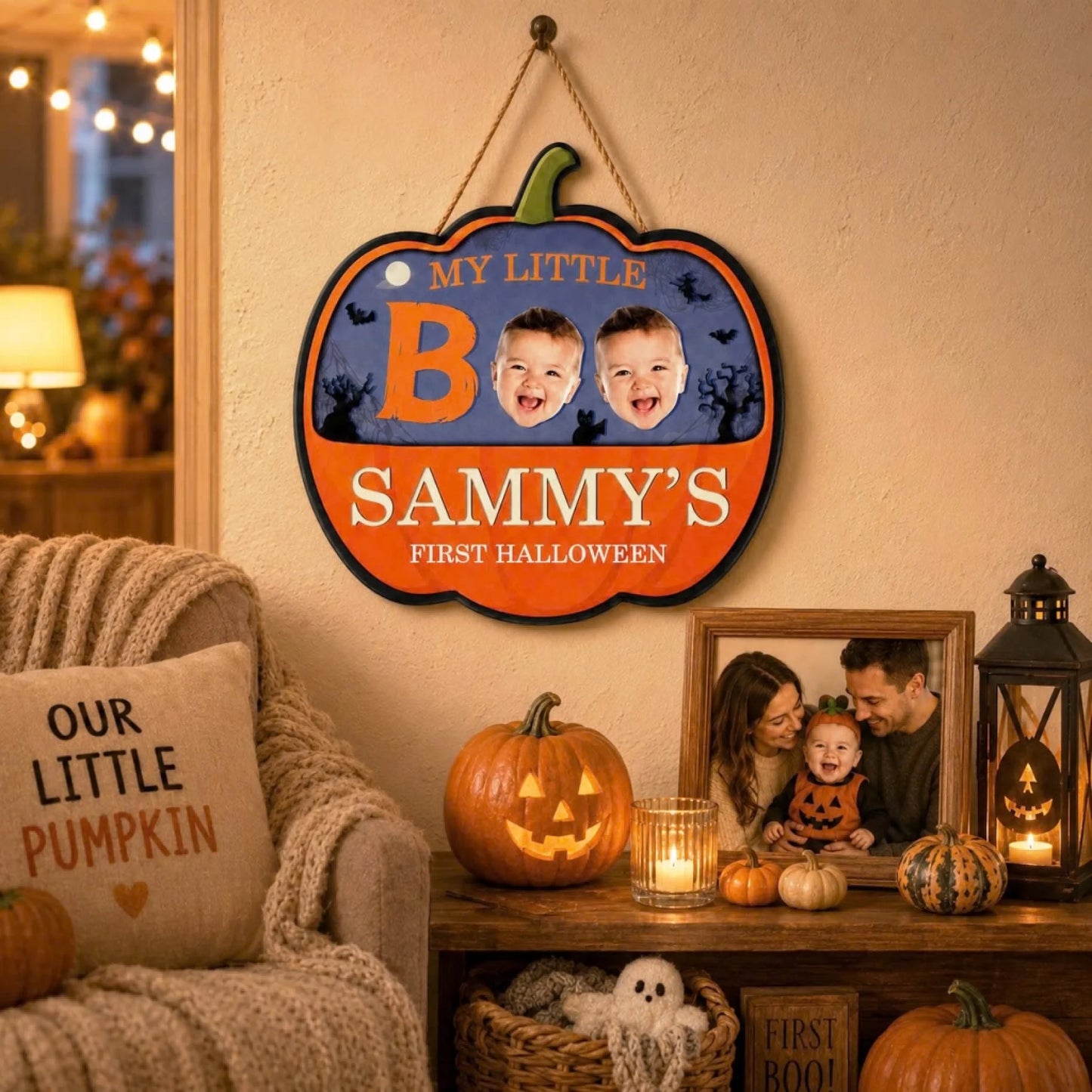 Personalized baby first Halloween wooden pumpkin sign featuring photos, displayed in a cozy living room decor setting.
