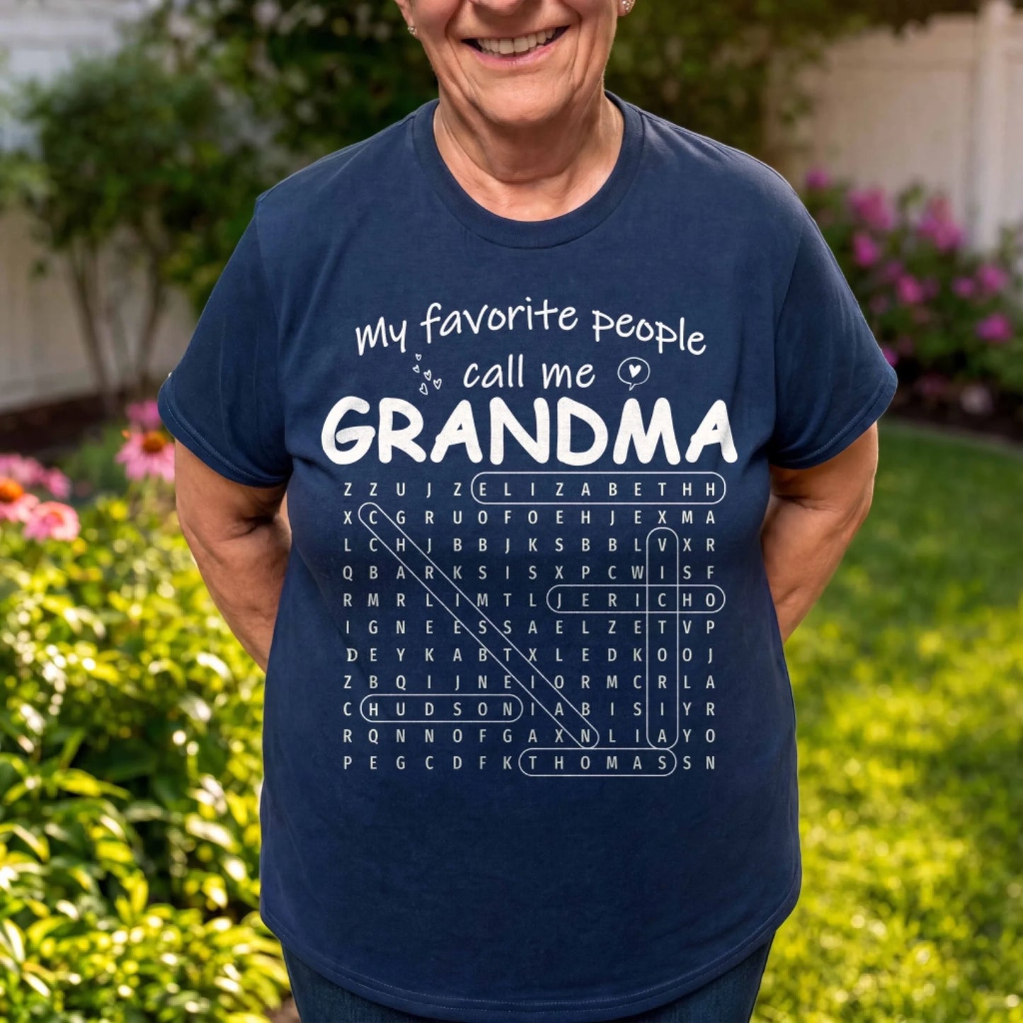 Navy blue personalized Grandma graphic tee with a word search design featuring custom family names, ideal for grandma.