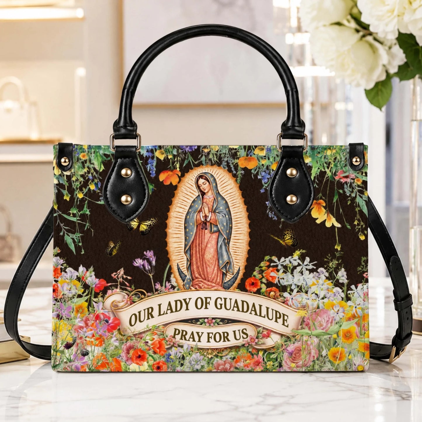 Beautiful Our Lady of Guadalupe handbag with a floral background and butterflies, perfect as a thoughtful spiritual gift.