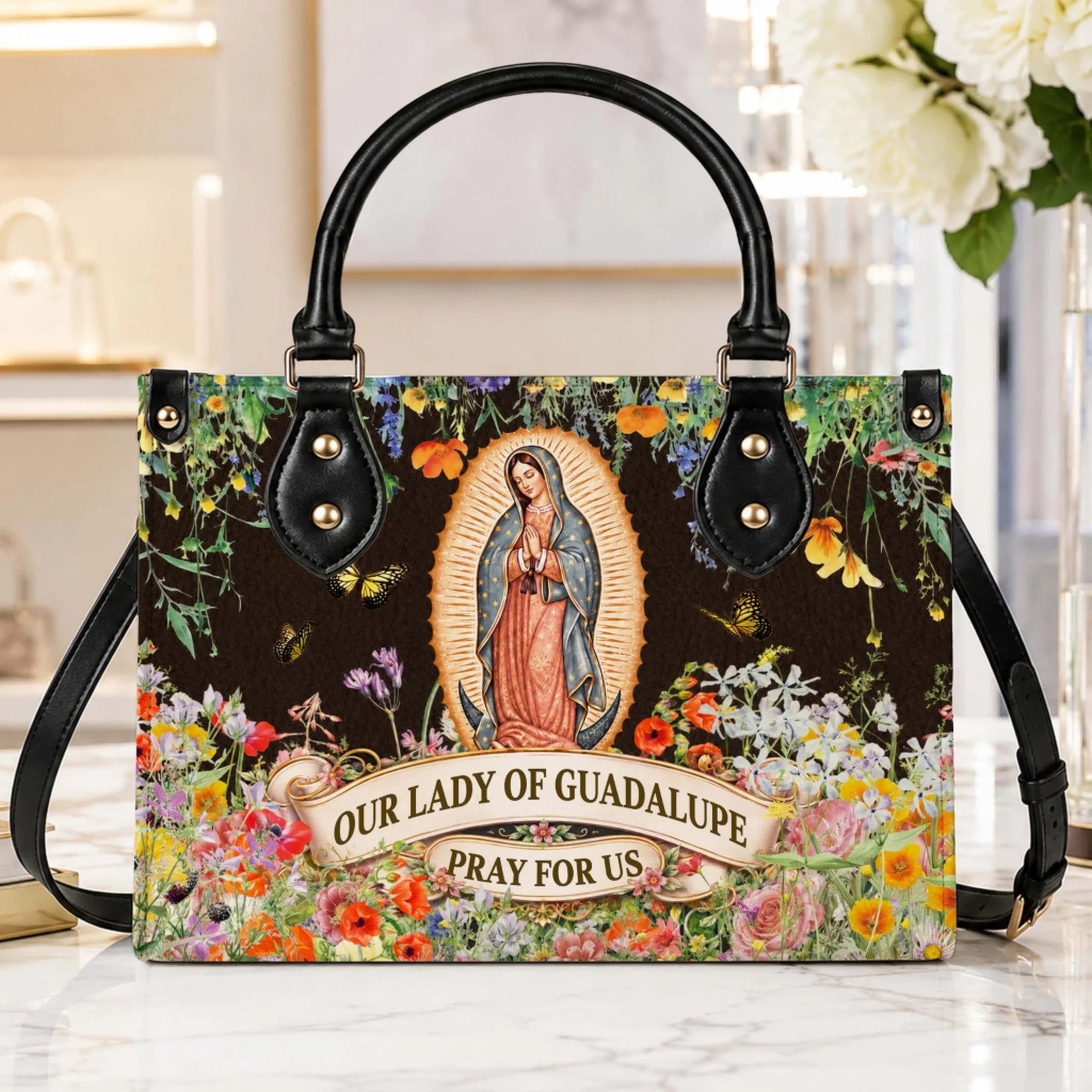 Beautiful Our Lady of Guadalupe handbag with a floral background and butterflies, perfect as a thoughtful spiritual gift.