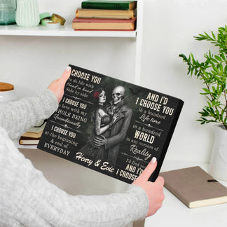 Person holding a romantic personalized skeleton couple canvas print with custom names Henry and Evie as a wedding gift.