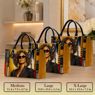 Set of three stylish pu leather handbags showing various sizes from medium to xl with a unique african art design.