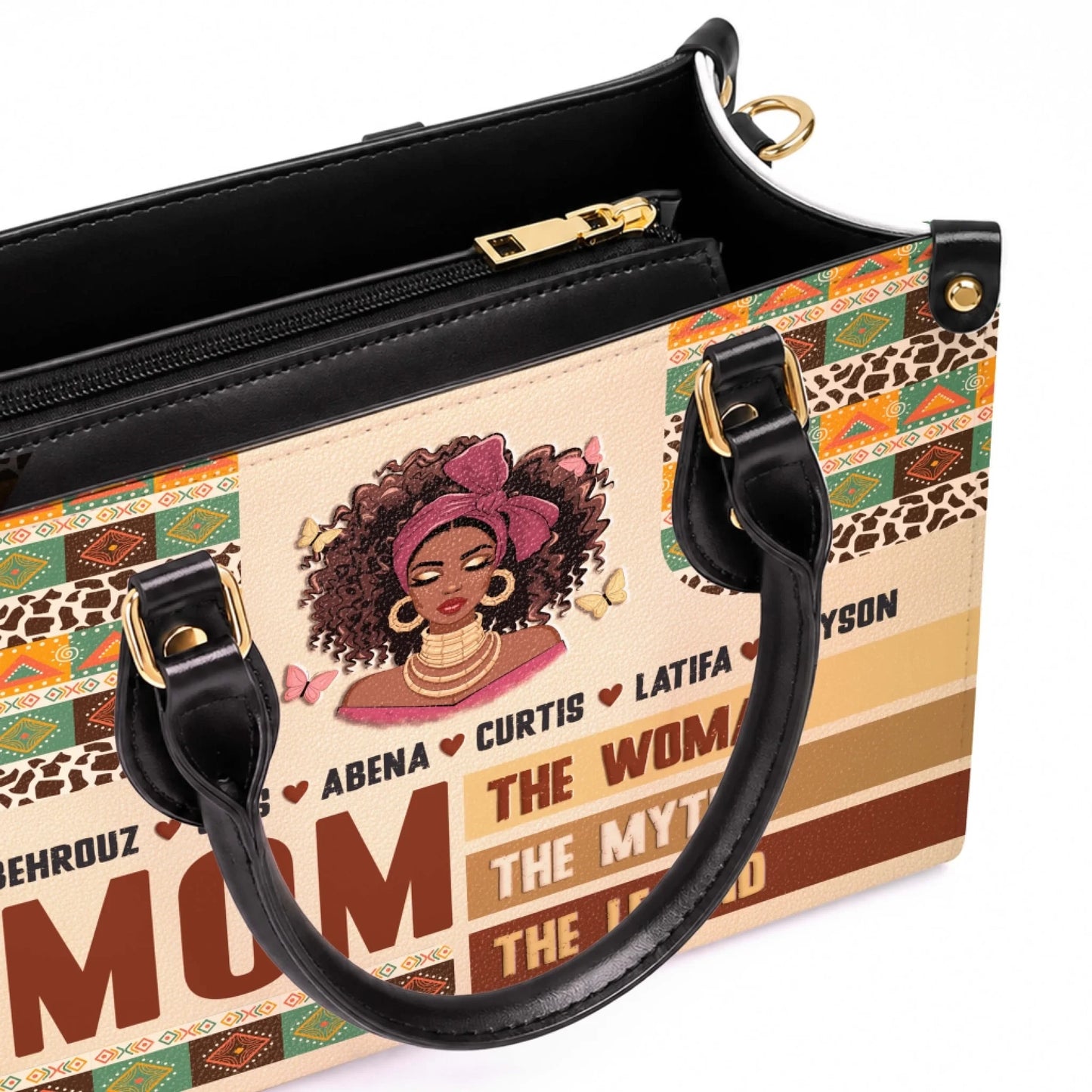 Close up of a custom leather tote bag for mom featuring an African American woman illustration, butterfly accents, and children names.