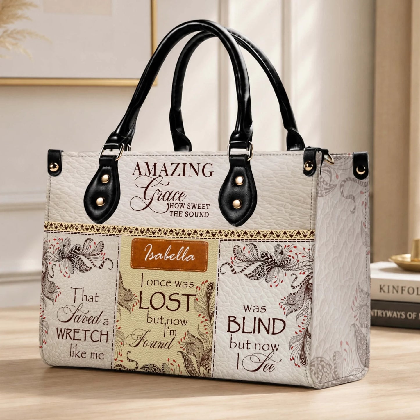 Elegant personalized handbag displaying the Amazing Grace song lyrics and Isabella for a faith-filled accessory.