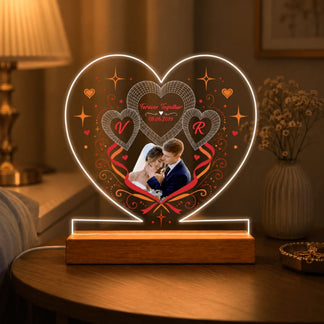 Custom engraved acrylic heart LED night light for couples featuring a wedding photo initials and anniversary date.